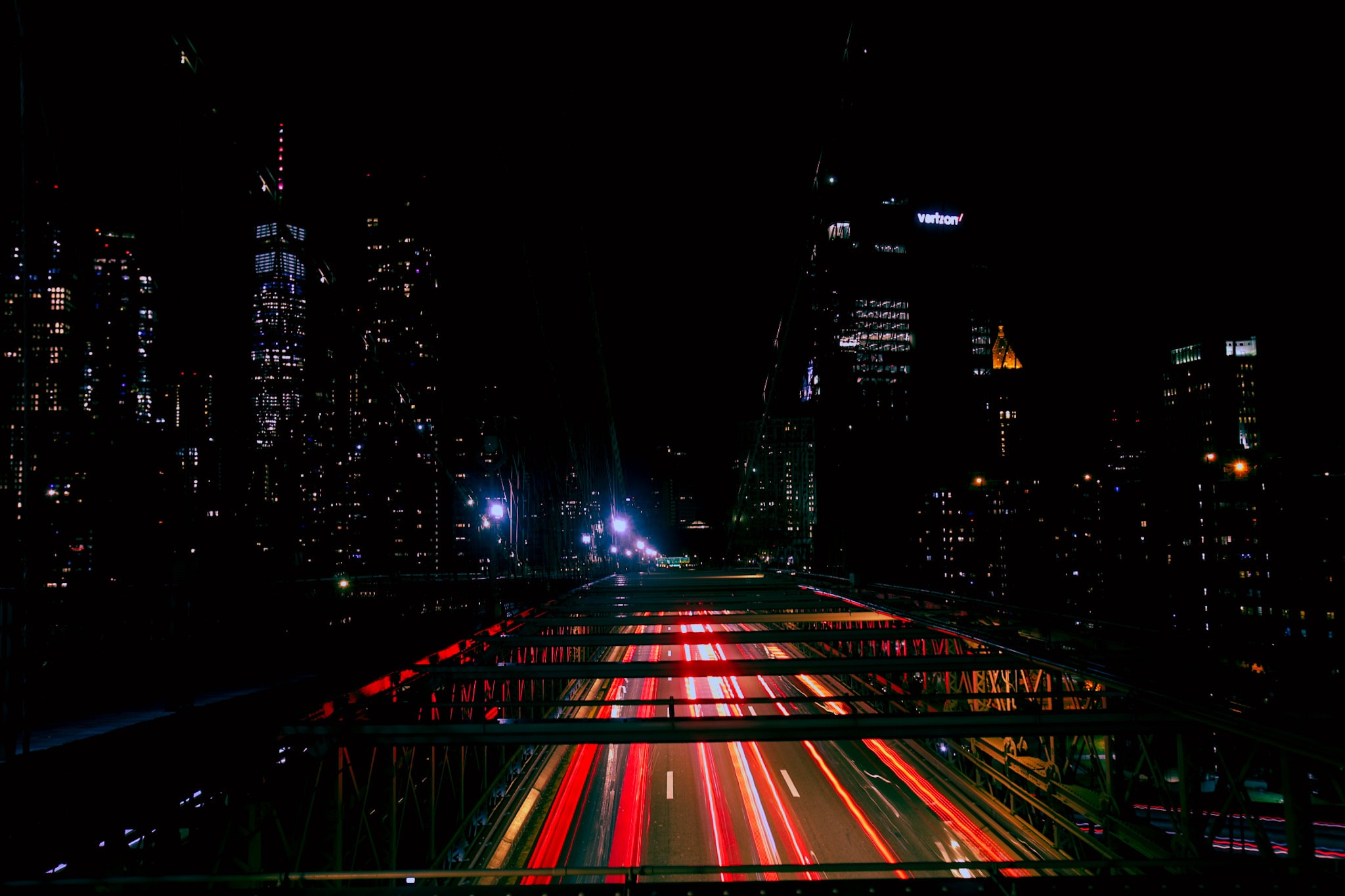 City highway at night with traffic light trails