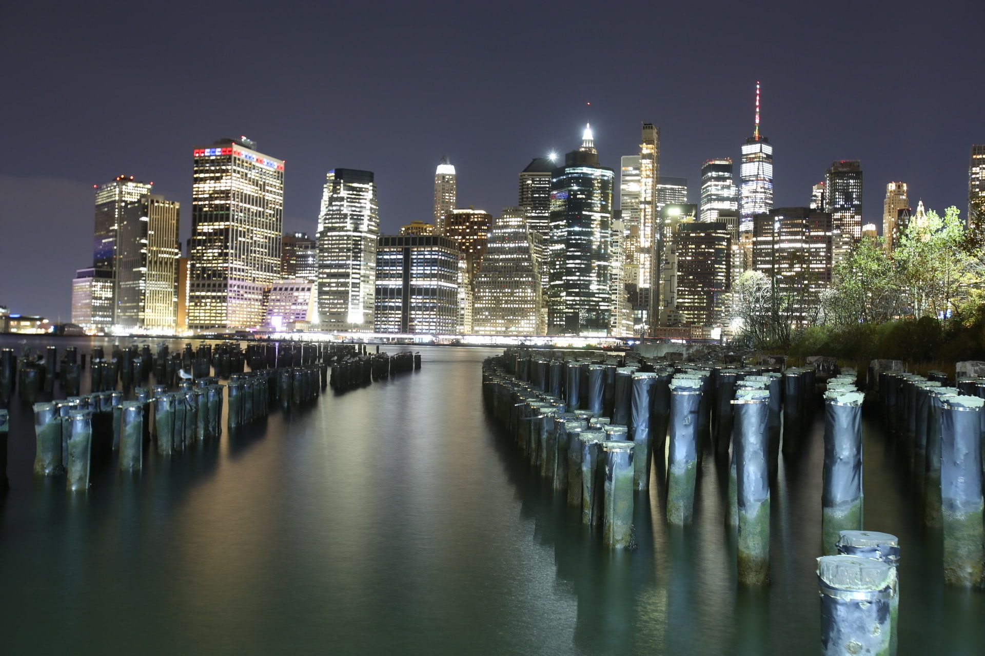 Manhattan skyline illuminated at dusk